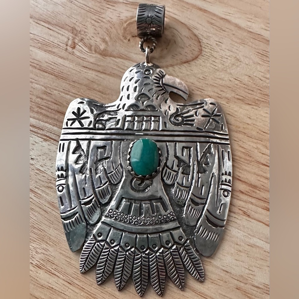 Intricate sterling Thunderbird with Turquoise